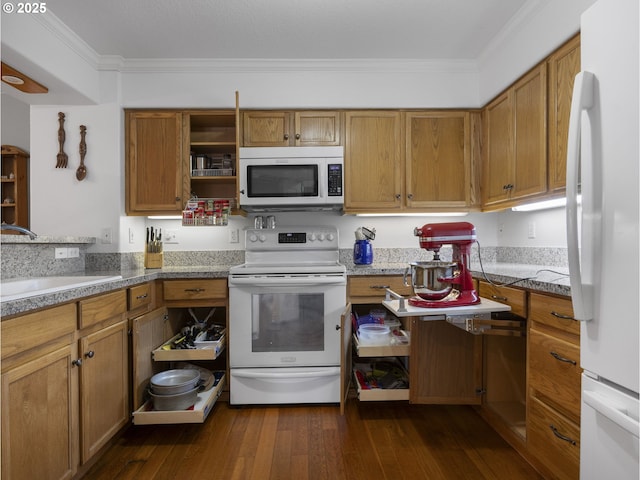 kitchen featuring sink, white appliances, crown molding, and dark hardwood / wood-style flooring