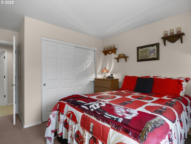 carpeted bedroom featuring a closet