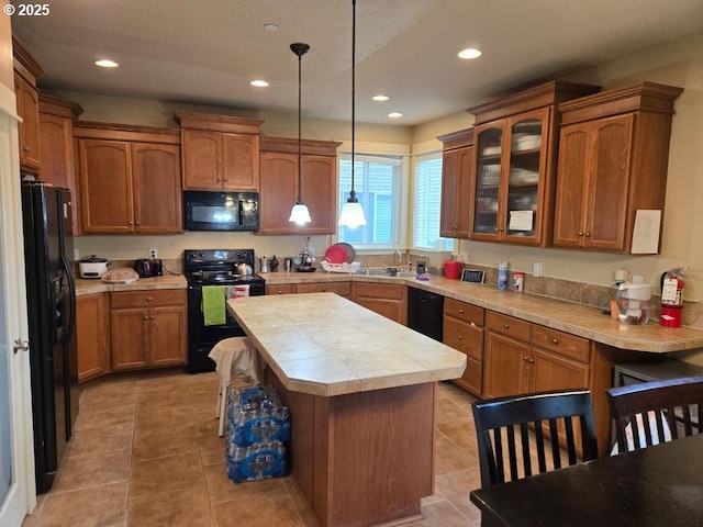 kitchen with light tile patterned floors, glass insert cabinets, black appliances, and brown cabinetry