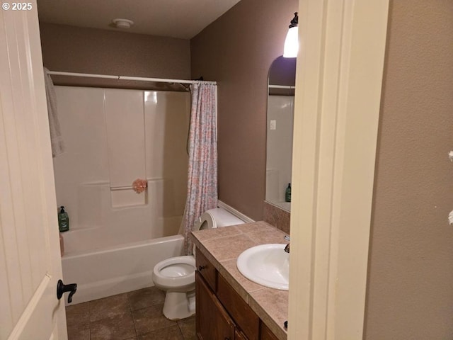 bathroom with tile patterned floors, shower / bath combo with shower curtain, toilet, and vanity