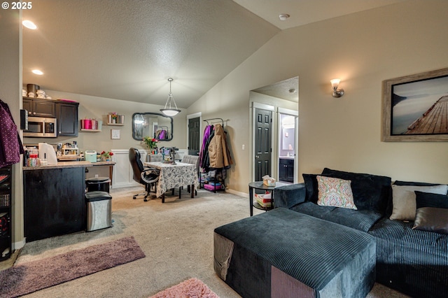 14019 NE 20th Ave Unit E44, Vancouver, WA 98686 - living room featuring light carpet, vaulted ceiling, baseboards, and recessed lighting