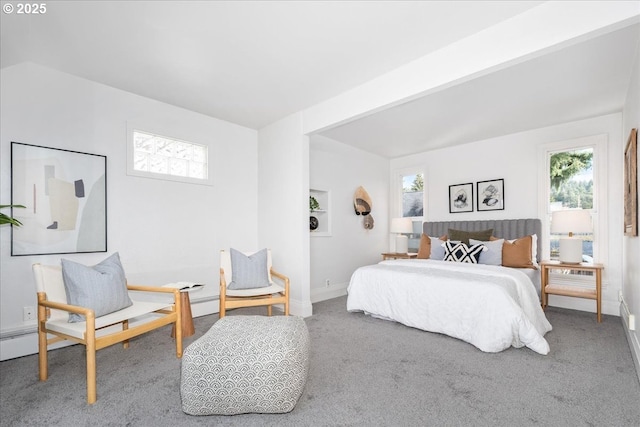 carpeted bedroom featuring baseboards