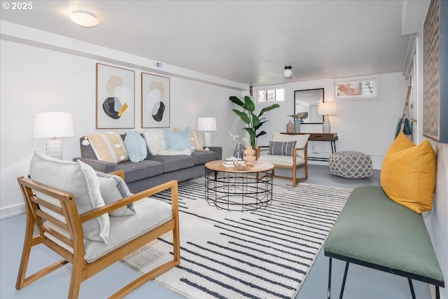 living room with visible vents and concrete floors