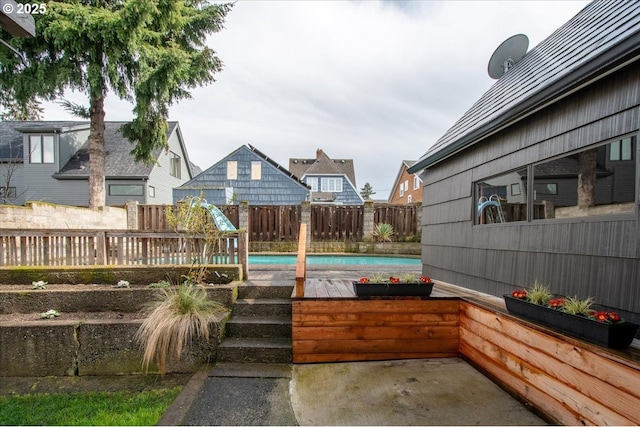 view of patio / terrace with a fenced in pool and a fenced backyard