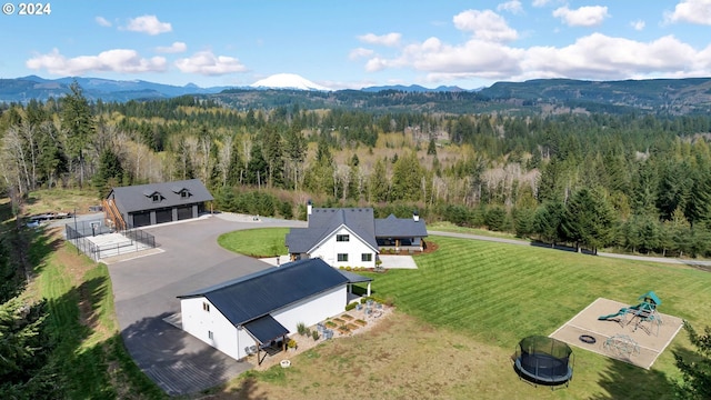 bird's eye view featuring a mountain view and a view of trees