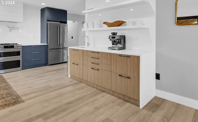 kitchen with stainless steel appliances, light wood-type flooring, modern cabinets, and open shelves