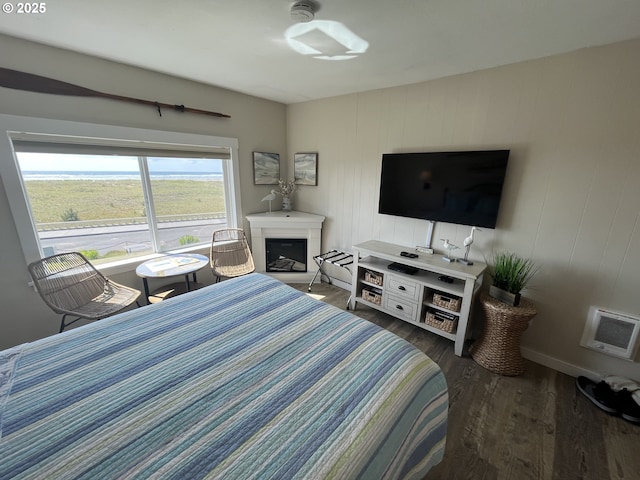 1022 N Prom, Seaside, OR 97138 - bedroom with wood finished floors and a fireplace with raised hearth