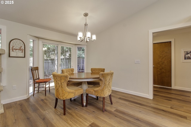 9403 SW 74th Ave, Portland, OR 97223 - dining space with a chandelier, wood finished floors, and vaulted ceiling