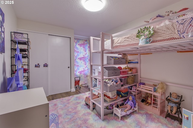 9403 SW 74th Ave, Portland, OR 97223 - bedroom with wood finished floors and a closet