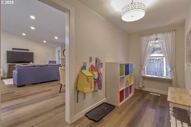 9403 SW 74th Ave, Portland, OR 97223 - playroom with wood finished floors, vaulted ceiling, and recessed lighting