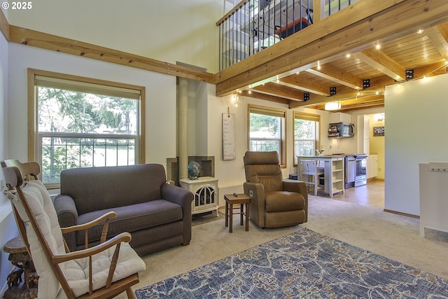 9403 SW 74th Ave, Portland, OR 97223 - living area featuring carpet, plenty of natural light, and a wooden ceiling with exposed beams
