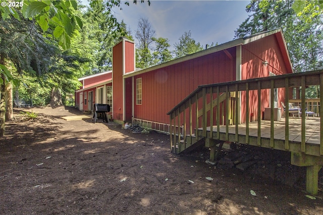 9403 SW 74th Ave, Portland, OR 97223 - view of side of property featuring a deck and a chimney