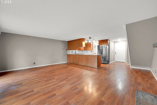 unfurnished living room featuring hardwood / wood-style floors