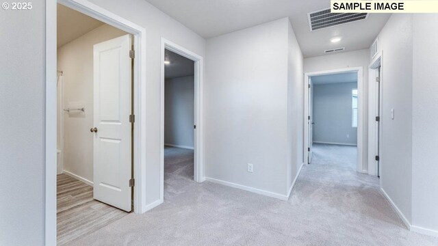 2124 NE 3rd Ave, Battle Ground, WA 98604 - hallway with baseboards, visible vents, and carpet flooring