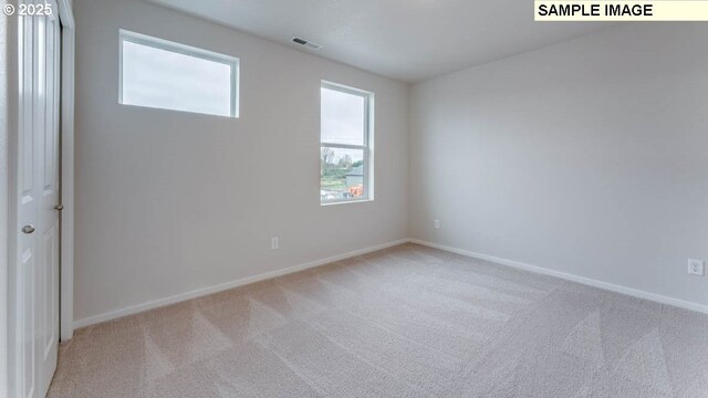 2124 NE 3rd Ave, Battle Ground, WA 98604 - spare room featuring carpet flooring, baseboards, and visible vents