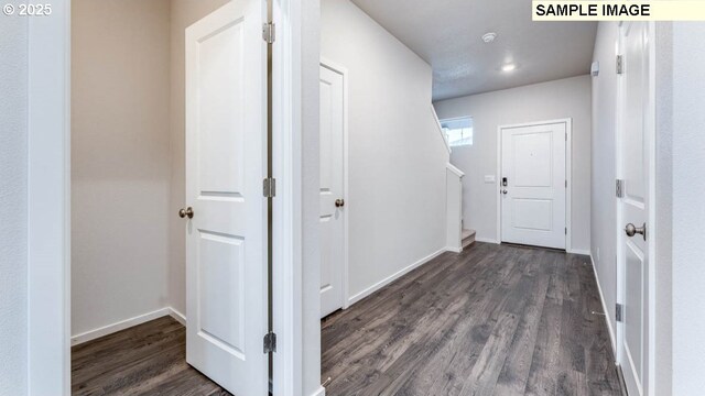 2124 NE 3rd Ave, Battle Ground, WA 98604 - hallway featuring baseboards, stairs, and dark wood-style floors