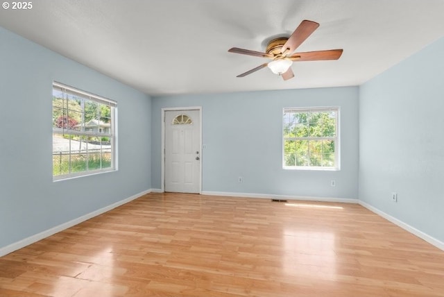 1235 SE Booth Ave, Roseburg, OR 97470 - empty room with light wood-type flooring, ceiling fan, and baseboards