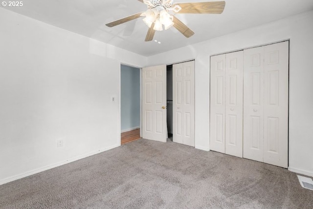 1235 SE Booth Ave, Roseburg, OR 97470 - unfurnished bedroom featuring multiple closets, carpet, baseboards, and a ceiling fan