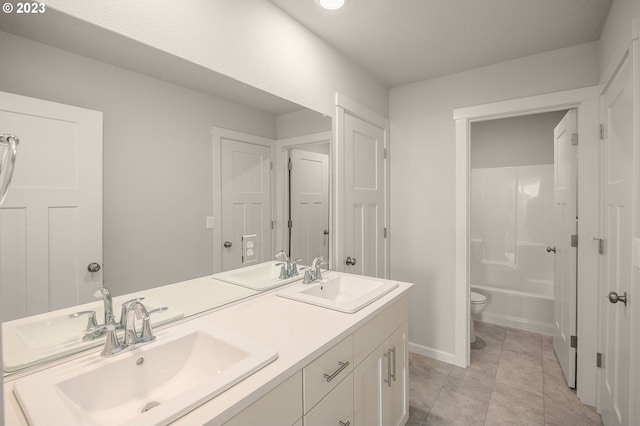 full bathroom with tub / shower combination, tile patterned flooring, vanity, a textured ceiling, and toilet