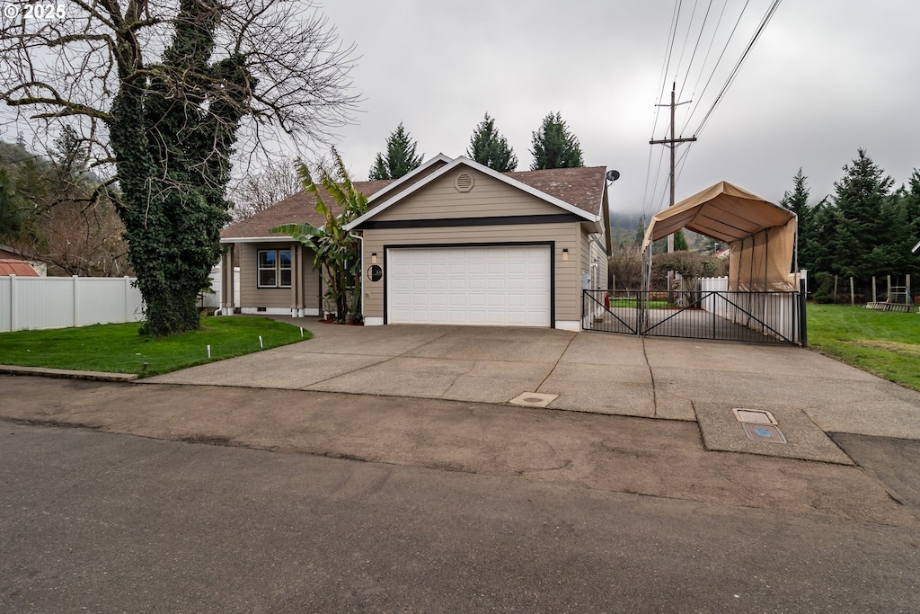 view of front of property with a garage, a front lawn, and a carport