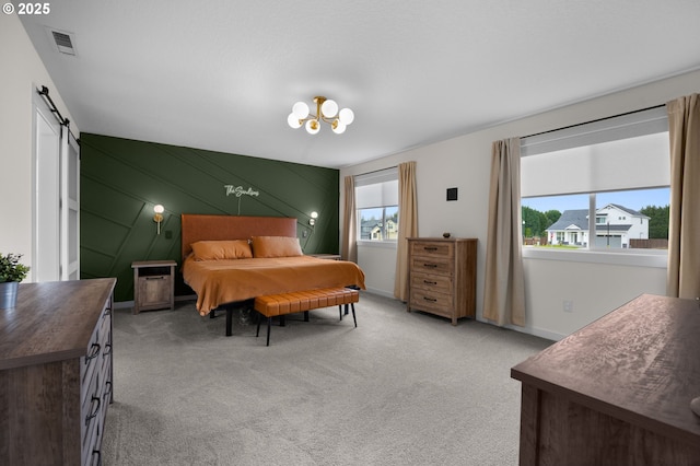 3838 SE 7th Ave, Battle Ground, WA 98604 - bedroom with a barn door, light colored carpet, a chandelier, and baseboards