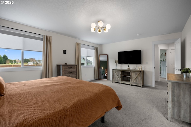 3838 SE 7th Ave, Battle Ground, WA 98604 - bedroom with a chandelier, carpet floors, and baseboards