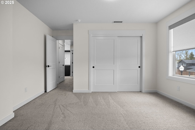 3838 SE 7th Ave, Battle Ground, WA 98604 - unfurnished bedroom featuring carpet flooring, baseboards, and a closet