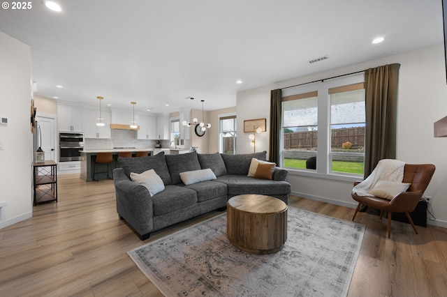 3838 SE 7th Ave, Battle Ground, WA 98604 - living area with recessed lighting, light wood-style flooring, and baseboards