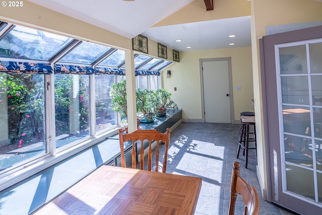 sunroom / solarium featuring baseboards, recessed lighting, and vaulted ceiling
