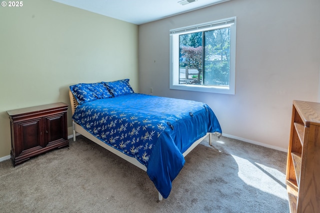bedroom featuring visible vents, baseboards, and carpet floors