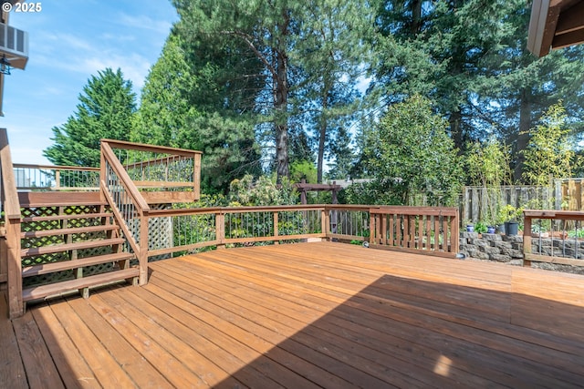 wooden deck featuring stairway