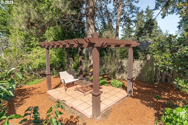 view of patio featuring fence