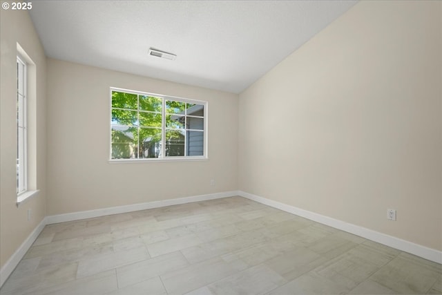 empty room with baseboards