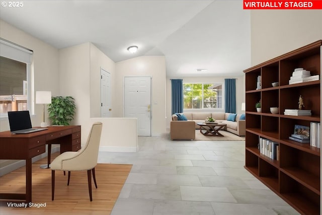home office featuring vaulted ceiling