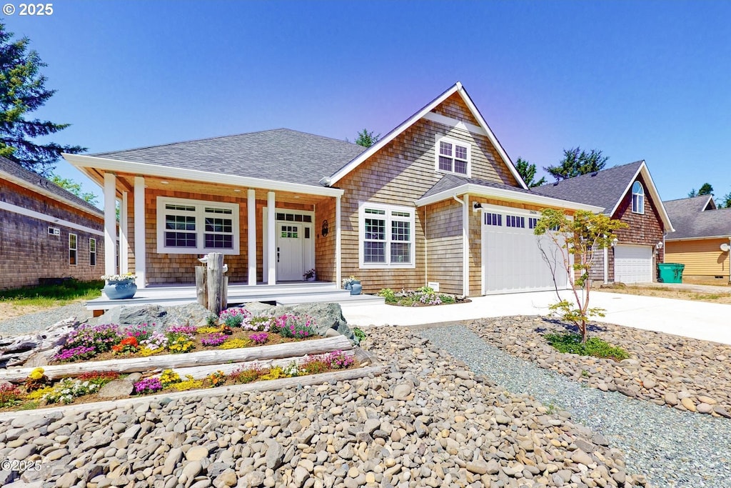 view of front of home with a garage and covered porch