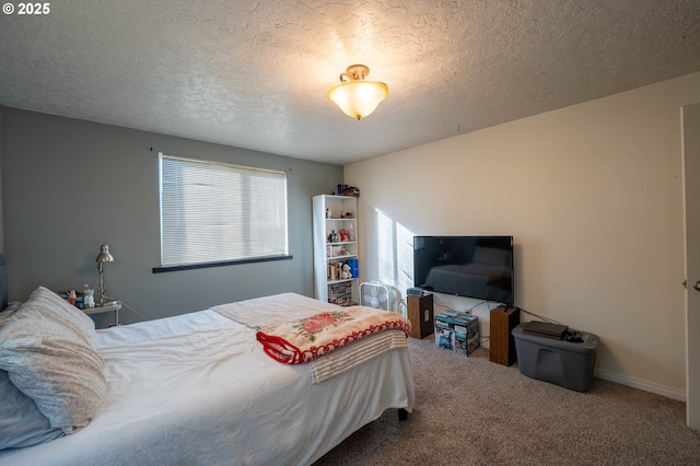 bedroom with a textured ceiling and carpet flooring