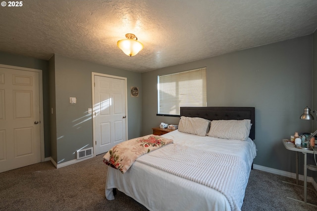 carpeted bedroom with a textured ceiling, visible vents, and baseboards