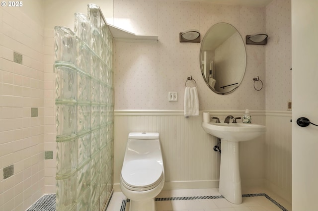 18005 SW Monte Verdi Blvd, Beaverton, OR 97007 - bathroom featuring a wainscoted wall, toilet, wallpapered walls, and tile patterned flooring