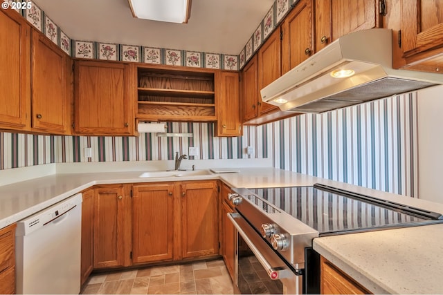 18005 SW Monte Verdi Blvd, Beaverton, OR 97007 - kitchen featuring dishwasher, stainless steel electric stove, under cabinet range hood, a sink, and wallpapered walls