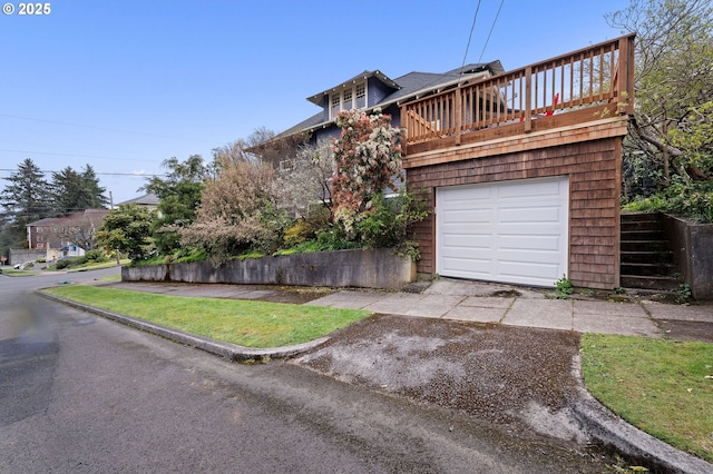 1219 Jerome Ave, Astoria, OR 97103 - view of front of home with an attached garage and driveway