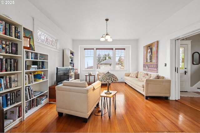 1219 Jerome Ave, Astoria, OR 97103 - living room with a notable chandelier and wood finished floors