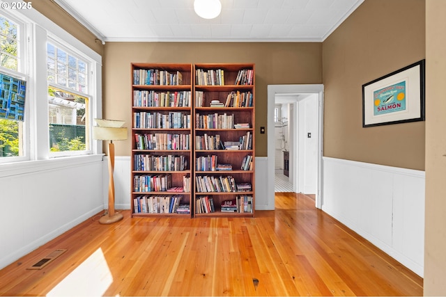 1219 Jerome Ave, Astoria, OR 97103 - sitting room featuring hardwood / wood-style flooring, wainscoting, and crown molding