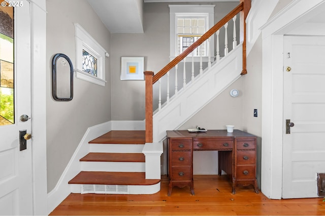 1219 Jerome Ave, Astoria, OR 97103 - stairs featuring plenty of natural light and wood-type flooring
