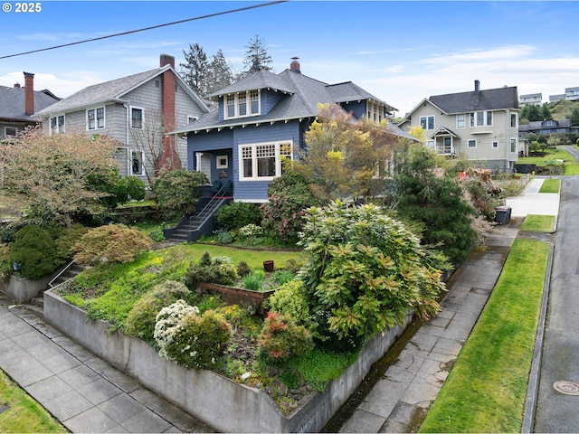 1219 Jerome Ave, Astoria, OR 97103 - view of front facade featuring a residential view, a chimney, and a front lawn