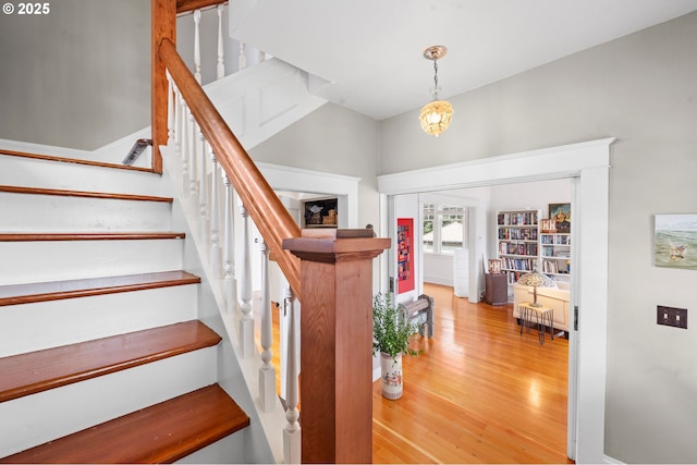 1219 Jerome Ave, Astoria, OR 97103 - stairway featuring an inviting chandelier and wood finished floors