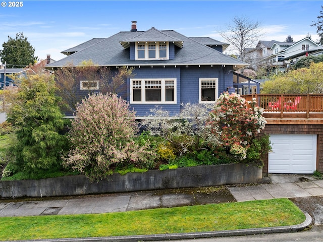 1219 Jerome Ave, Astoria, OR 97103 - view of front facade featuring a chimney, a garage, and roof with shingles