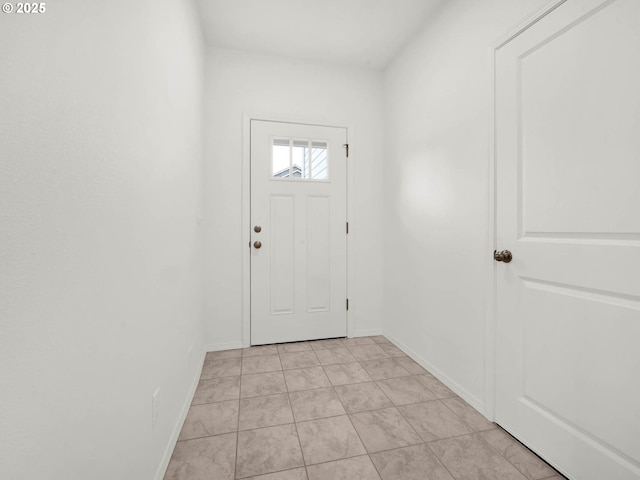 entryway with light tile patterned floors