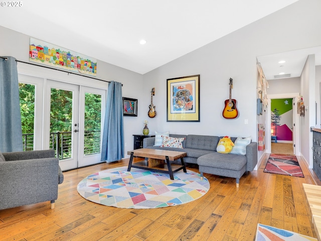104 S Pl, Astoria, OR 97103 - living area featuring light wood-type flooring, french doors, vaulted ceiling, and recessed lighting