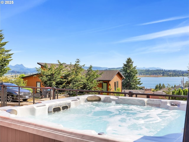 104 S Pl, Astoria, OR 97103 - view of swimming pool featuring a hot tub and a water and mountain view