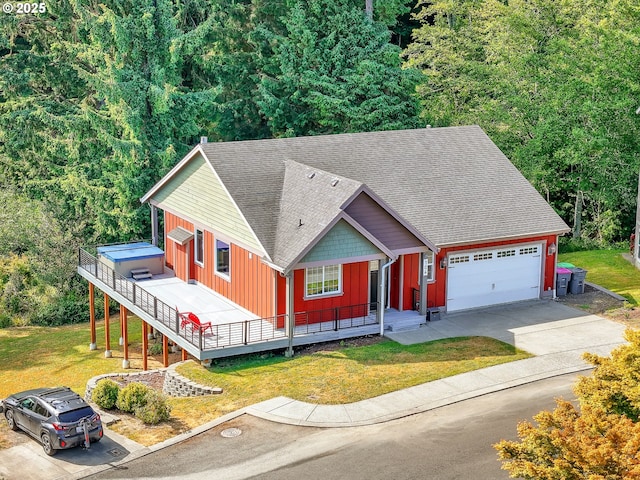 104 S Pl, Astoria, OR 97103 - view of front of home with board and batten siding, a shingled roof, a front lawn, an attached garage, and concrete driveway